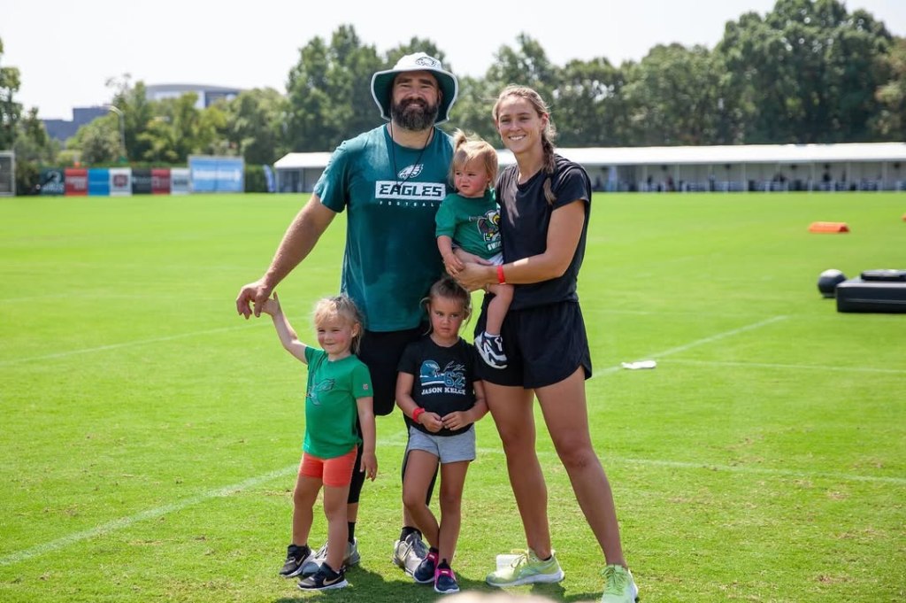 Jason Kelce and wife Kylie Kelce pose with their daughters.