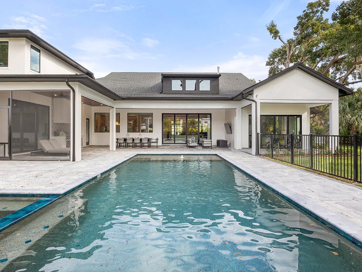 Backyard amenities at the property, including a resort-style pool and spa.