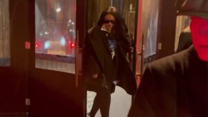 Rihanna laughs after a glass door bumps her face outside the Four Seasons in New York City (video still; Backgrid)
