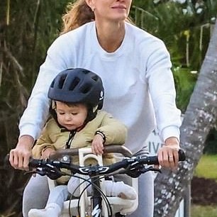 And while she opted to not don flashy jewelry for the weekend outing, a gold band was spotted on her ring finger - DailyMailUS