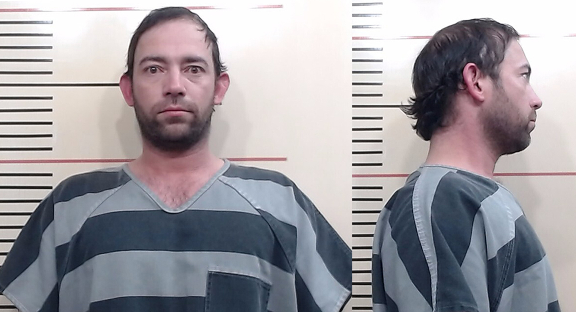 Mugshot of Adan Banuelos in a striped jumpsuit, facing forward and to the side.