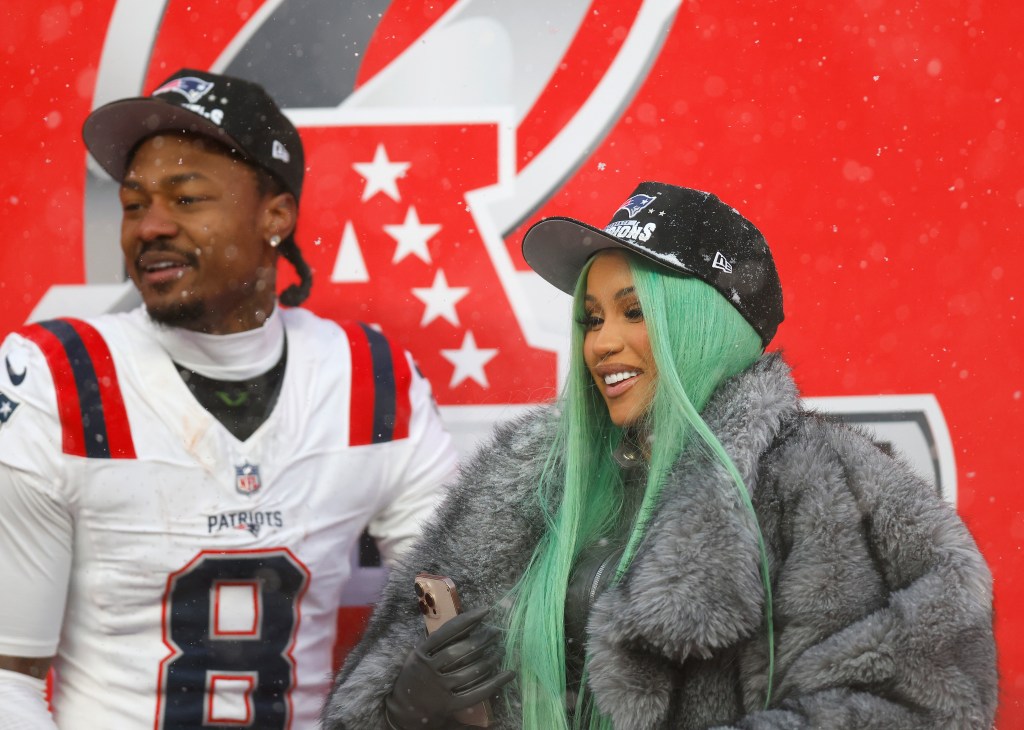 Cardi B and Stefon Diggs celebrating at the AFC Championship Playoff game.